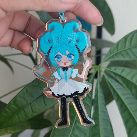 Acryl Charm Acrylic Charm showing a blue haired girl smiling